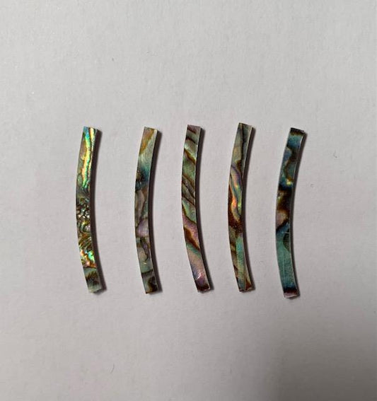 <p>Green abalone laminated curved strips 2.5mm (0.1") width x 32mm (.25") length x 1.3mm (0.05") thickness x 120mm (4.72") inside diameter. A grade quality good on both sides, flat and uniform in thickness and width. Ideal for use in purfling and rosettes on musical instruments - Ukuleles, guitars, mandolins etc. as well as in furniture, jewellery ans other decorative applications.</p>