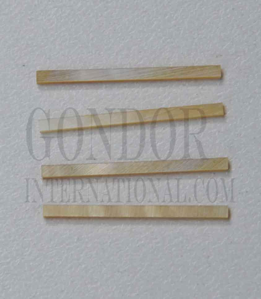 Gold MOP solid shell straight strips 1.6mm (0.063") width x Random  length x 1.3mm (0.05") thickness. A grade quality good on both sides, flat and uniform in thickness and width. Ideal for use in purfling on musical instruments - Ukuleles, guitars, mandolins etc. as well as in furniture, jewellery ans other decorative applications.