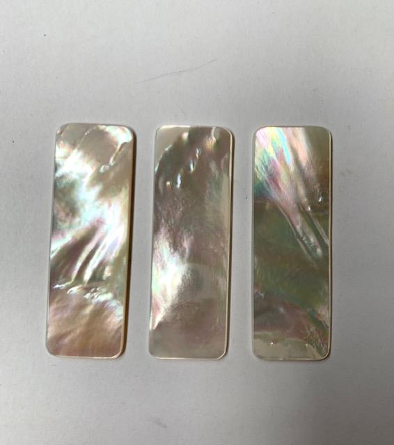 <p>White Mother of Pearl flat inlay blanks round edges polished 2 sides size 20mm (0.79") width x 60mm (2.36") length x 1.5mm (0.06") thickness A grade clean on both sides.</p>