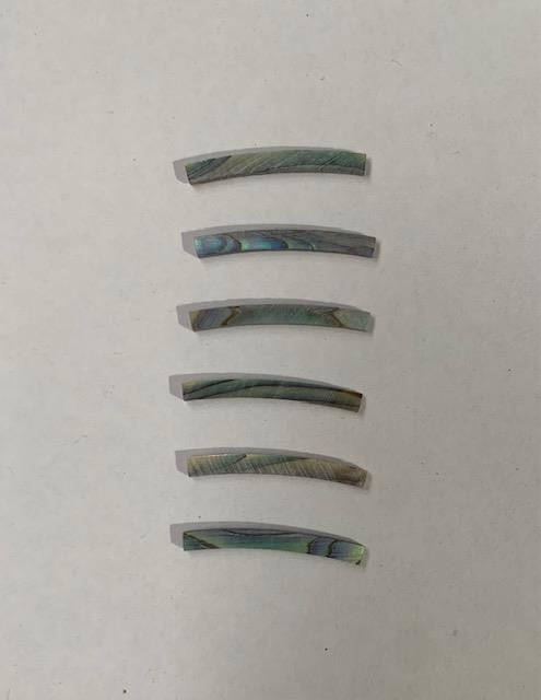 <p>Paua abalone laminated shell curved strips 2mm (0.08") width x 24mm (0.9") length x 1.5mm (0.06") thickness x 110mm (4.33") inside diameter. A grade quality&nbsp; flat and uniform in thickness and width. Ideal for use in purfling and rosettes on musical instruments - Ukuleles, guitars, mandolins etc. as well as in furniture, jewellery and other decorative applications.</p>