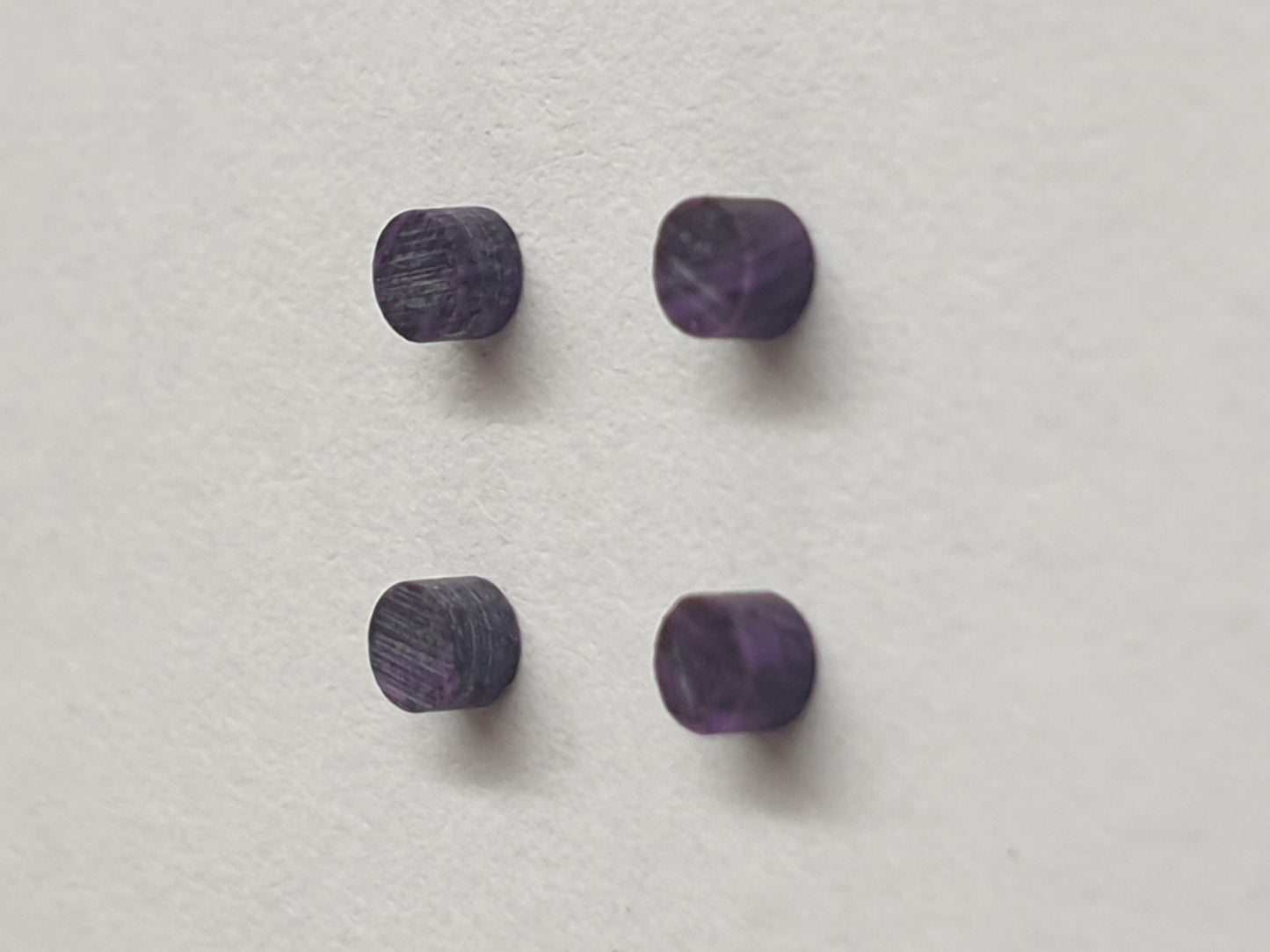 <p>A darker Amethyst SUGID dots 2mm diameter x 1.5mm thickness - round flat pcs cut to precise diameter and thickness. Ideal for use in inlay applications - for fretboard markers, and general inlay or jewellery decorations. All dots are A grade good on both sides. Note if you would like a lighter colour of purple you may like CHAR7 Amethyst.</p>