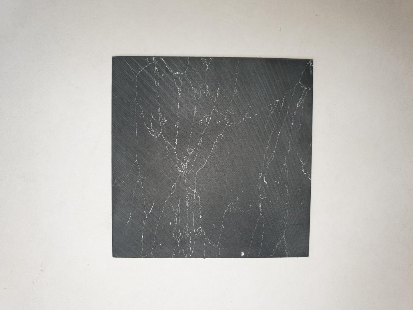 <p>Marble black blanks F050 reconstituted stone blanks 50 x 50 x 1.5mm suitable for inlay. Can be cut with standard cutting tools - jewellery saw similar in characteristics to mother of pearl (hardness approx. 3. Can be sanded and polished same way as shell material. All pieces are A grade good on both sides.</p>