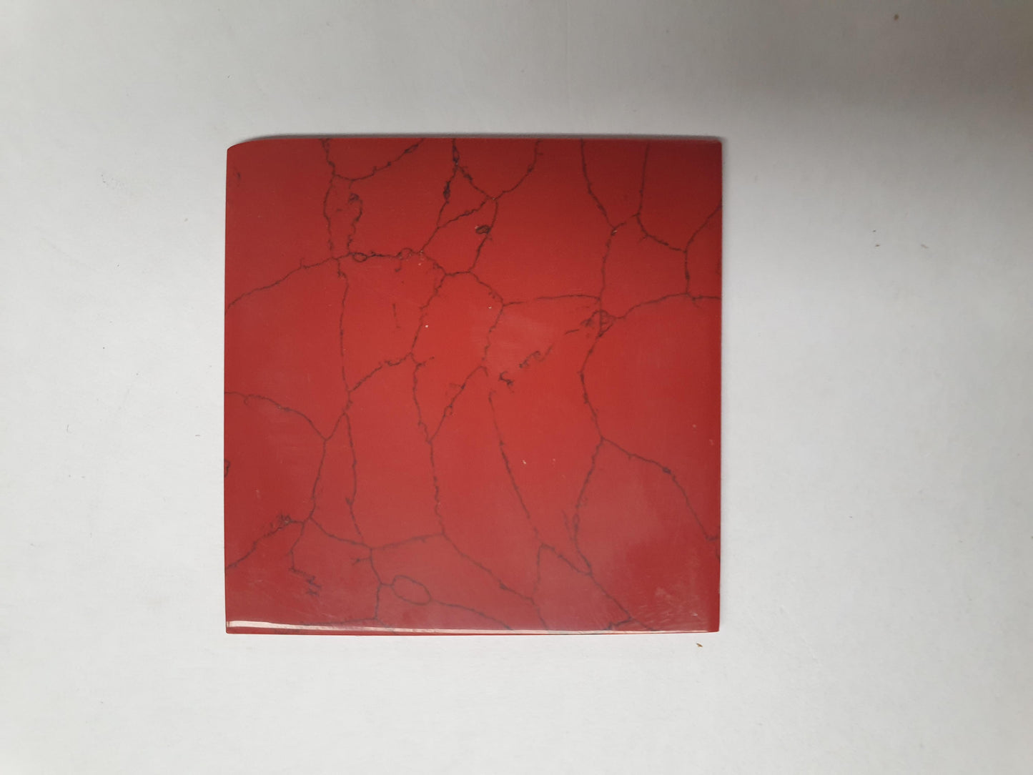 <p>Bloody Jasper reconstituted stone blanks 50 x 50 x 1.5mm polished 1 side suitable for inlay. Can be cut with standard cutting tools - jewellery saw similar in characteristics to mother of pearl (hardness approx. 3. Can be sanded and polished same way as shell material. All pcs are A grade good on both sides.</p>