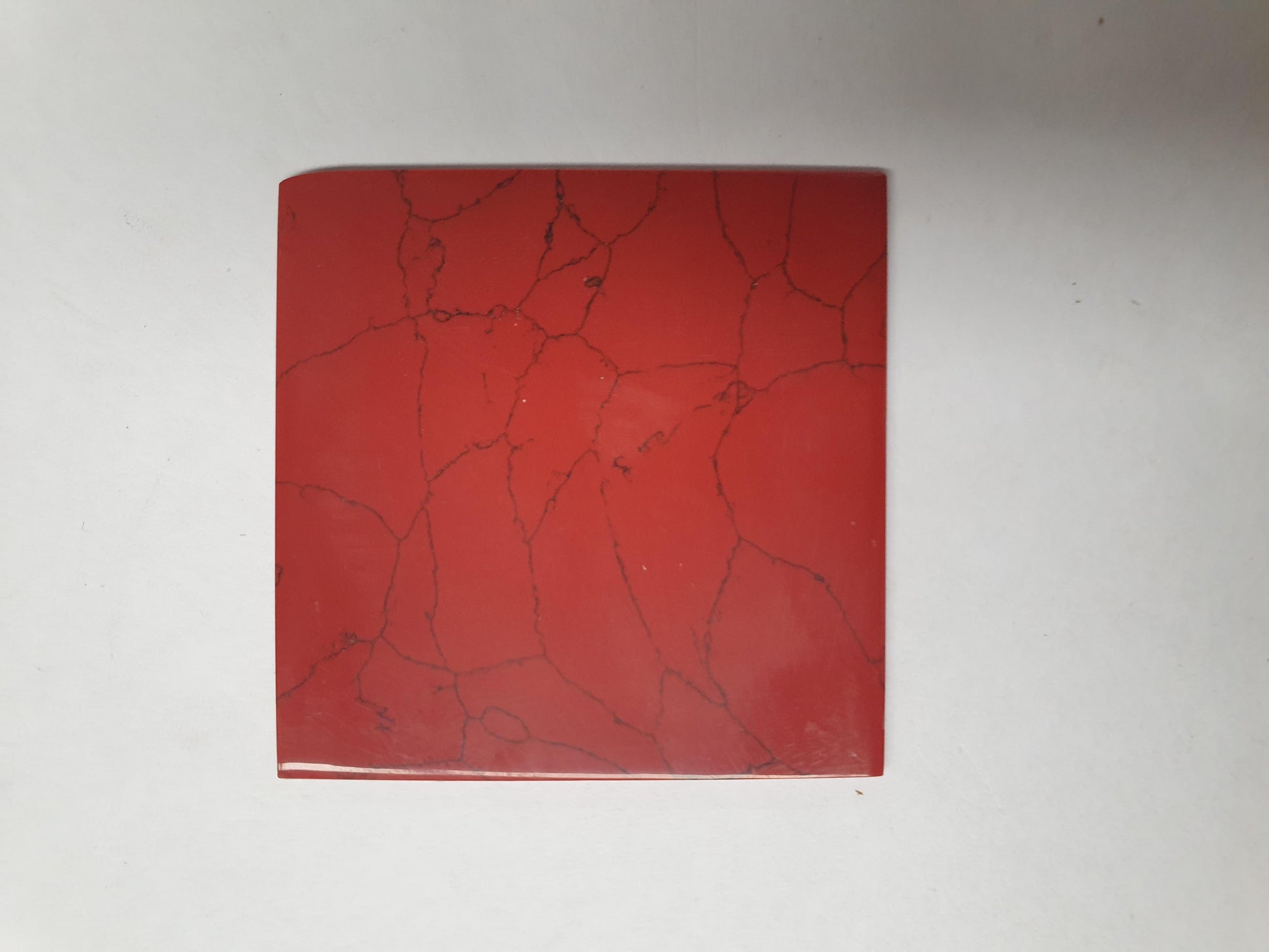 <p>Bloody Jasper reconstituted stone blanks 50 x 50 x 1.5mm polished 1 side suitable for inlay. Can be cut with standard cutting tools - jewellery saw similar in characteristics to mother of pearl (hardness approx. 3. Can be sanded and polished same way as shell material. All pcs are A grade good on both sides.</p>