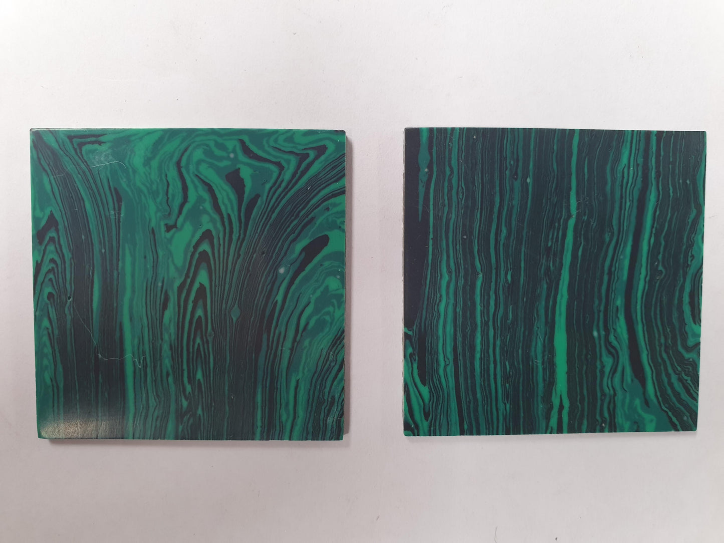 <p>Malachite H01 reconstituted stone blanks 50 x 50 x 1.5mm polished 1 side suitable for inlay. Can be cut with standard cutting tools - jewellery saw similar in characteristics to mother of pearl (hardness approx. 3. Can be sanded and polished same way as shell material. All pcs are A grade good on both sides.</p>