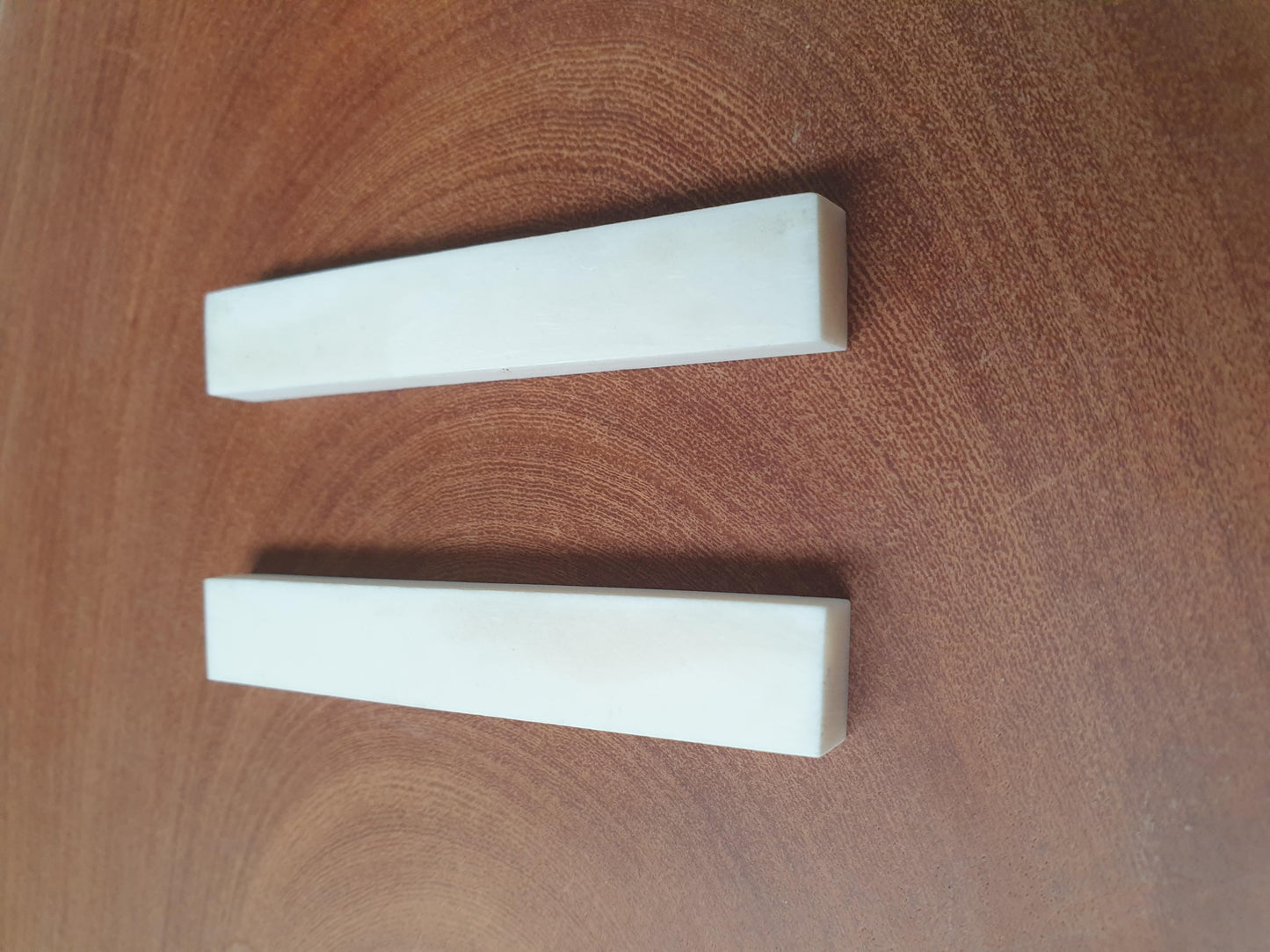 Bone saddle blanks size 11mm (0.433") width x 70mm (2.75") length x 6.5mm (0.26") thickness used in musical instruments i.e. guitars, mandolins, ukuleles etc. 