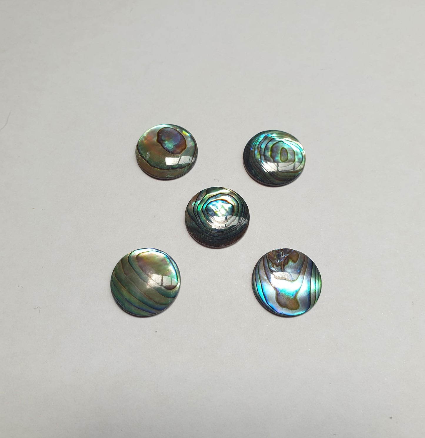 <p>Paua domed finger button inlay 15mm (0.59") diameter 2.5mm (0.098") thickness domed and polished on 1 side round pcs Ideal for use in brasswind or woodwind instruments as well as accordions and general inlay or jewellery decorations.</p>