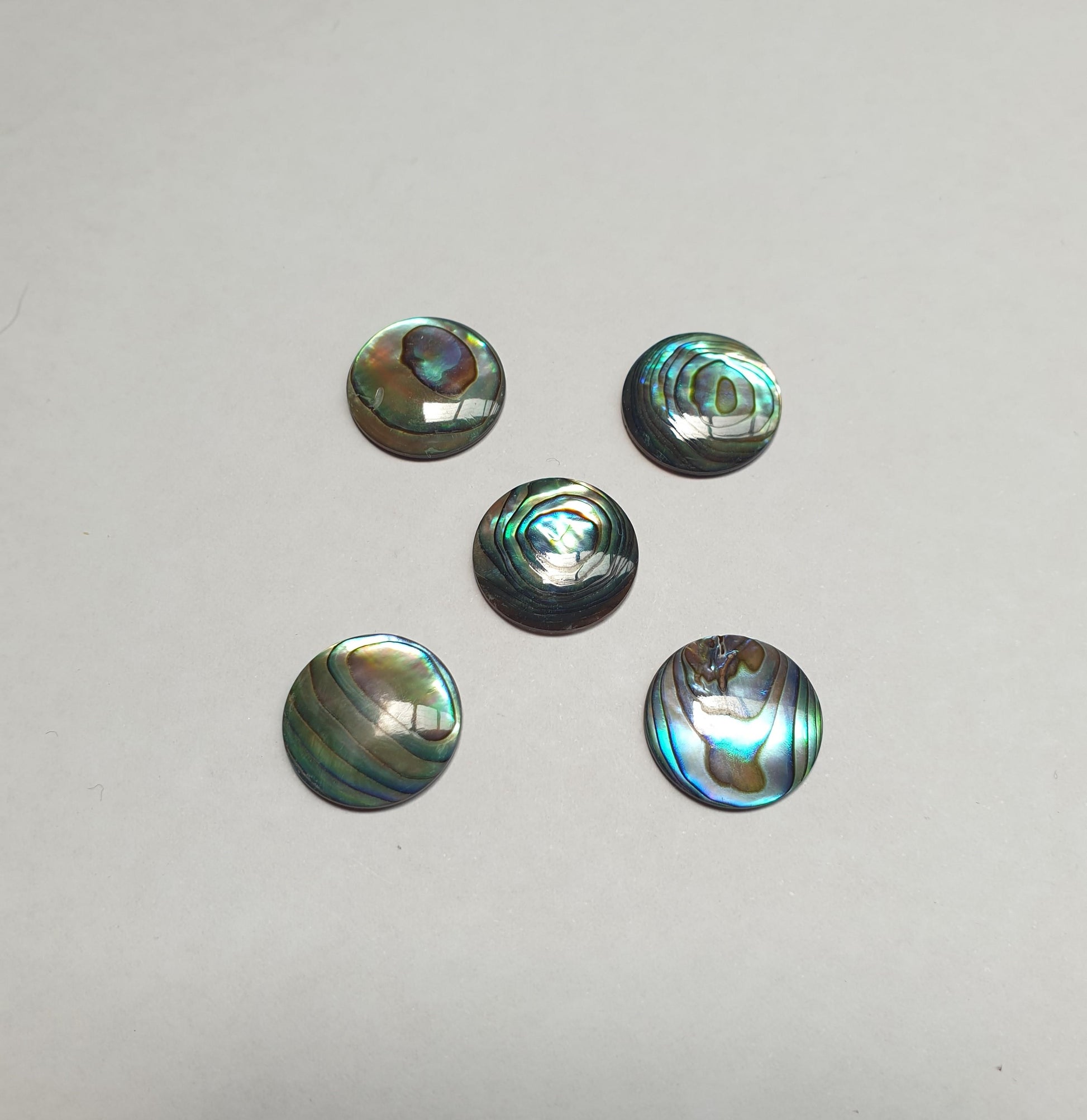 <p>Paua domed finger button inlay 15mm (0.59") diameter 2.5mm (0.098") thickness domed and polished on 1 side round pcs Ideal for use in brasswind or woodwind instruments as well as accordions and general inlay or jewellery decorations.</p>