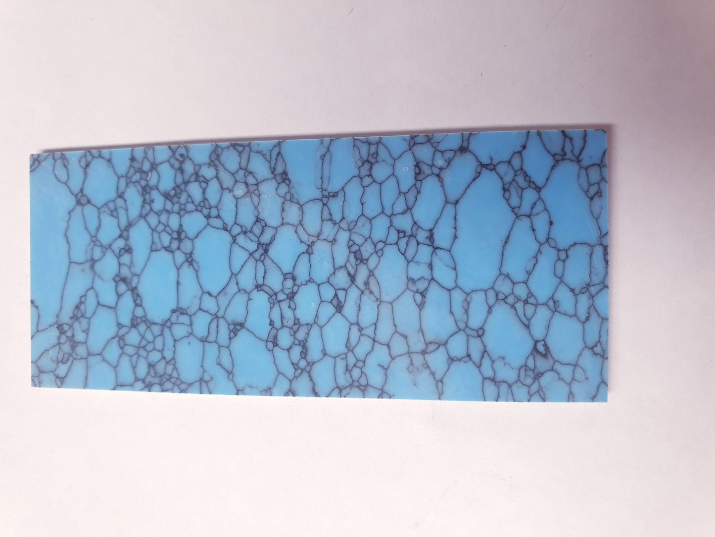 <p>Turquoise B1 reconstituted stone blanks 30 x 70 x 1.5mm polished both sides suitable for inlay. Can be cut with standard cutting tools - jewellery saw similar in characteristics to mother of pearl (hardness approx. 3. Can be sanded and polished same way as shell material. All pcs are A grade good on both sides.</p>