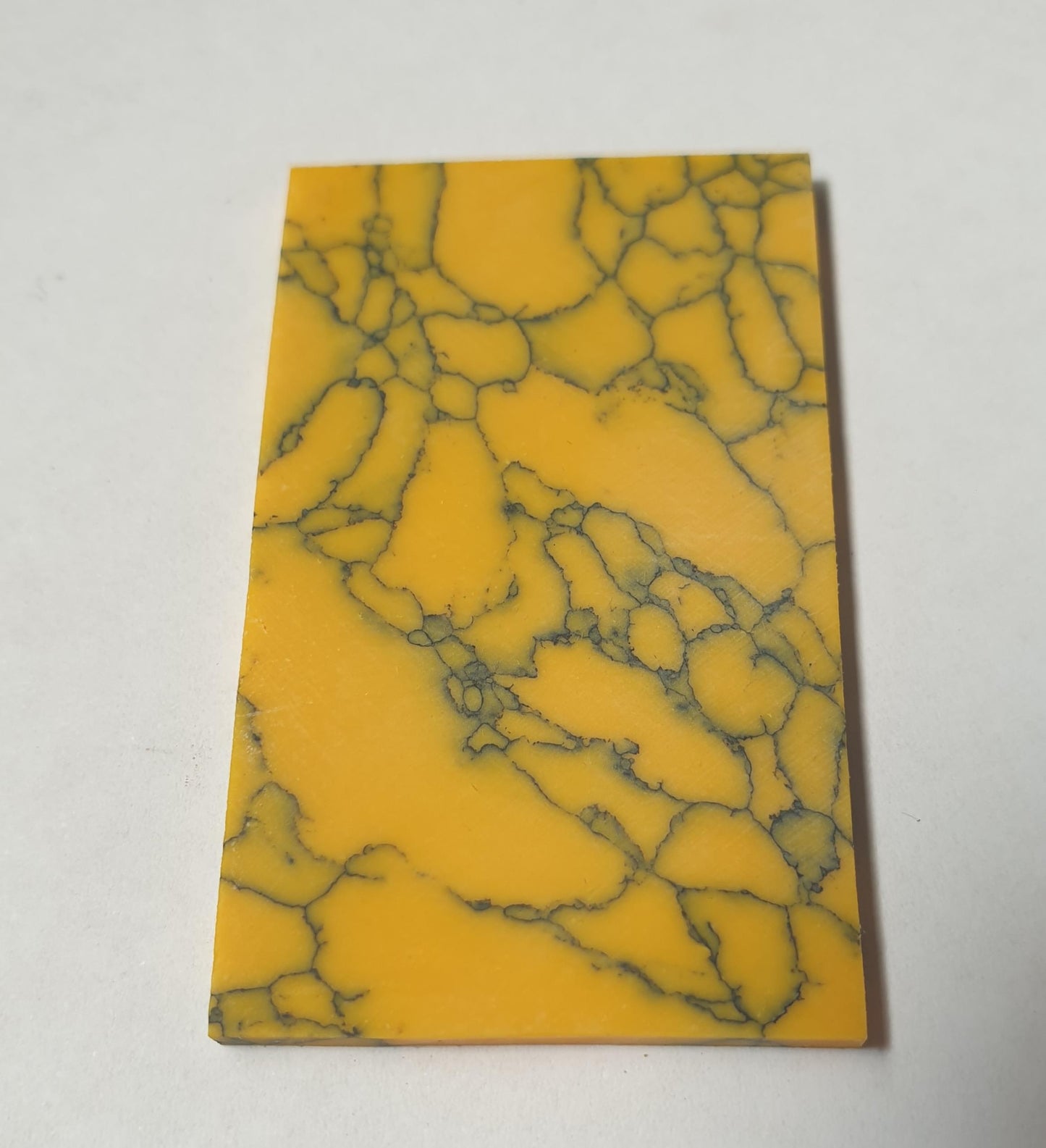 <p>Yellow Stone artificial stone blanks 30 x 50 x 2mm suitable for inlay. Can be cut with standard cutting tools - jewellery saw similar in characteristics to mother of pearl (hardness approx. 3. Can be sanded and polished same way as shell material. All pcs are A grade good on both sides.</p>