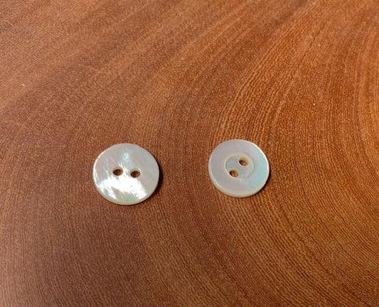 <p>White Mother of Pearl buttons 2 hole size 20L (12.66mm) x 2mm thickness white both sides, finished buttons.</p>