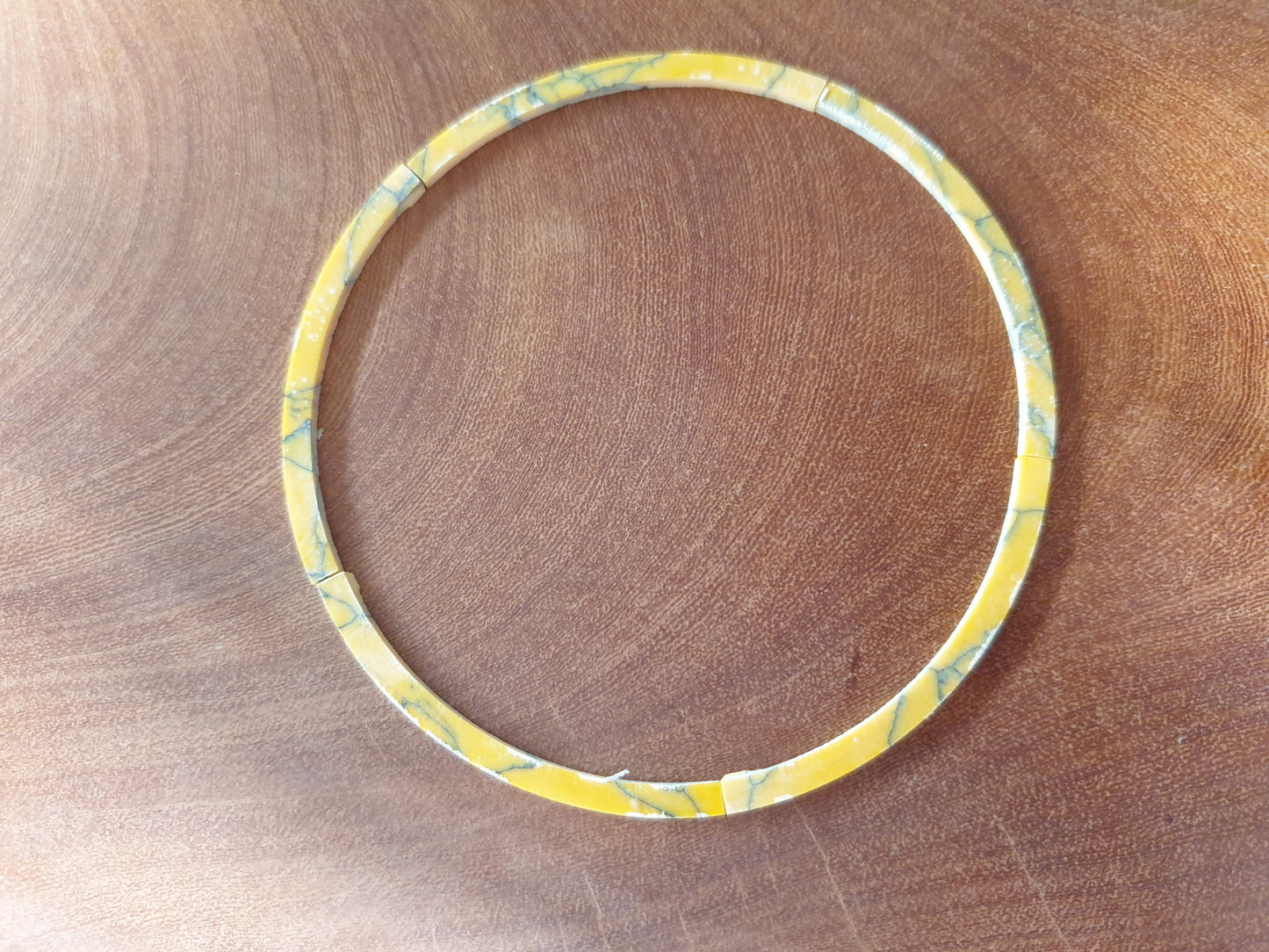 <p>1 set (full rosette) Yellow stone Y114 artificial stone curved strip rosette 3.17mm width x 76.2mm (3") inside diameter curve x 1.5mm (0.06") thickness. A grade quality good on both sides, flat and uniform in thickness and width. Ideal for use in purfling and rosettes on musical instruments - Ukuleles, guitars, mandolins etc. as well as in furniture, jewellery and other decorative applications.</p>