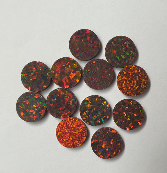 <p>Opal dots OP20 6.35 x 1.3mm flat pcs made to specific diameter and thickness made from manufactured opal suitable for inlay, fretboard markers, jewellery, Opal dots can be worked same way as mother of pearl and are of similar hardness.</p>