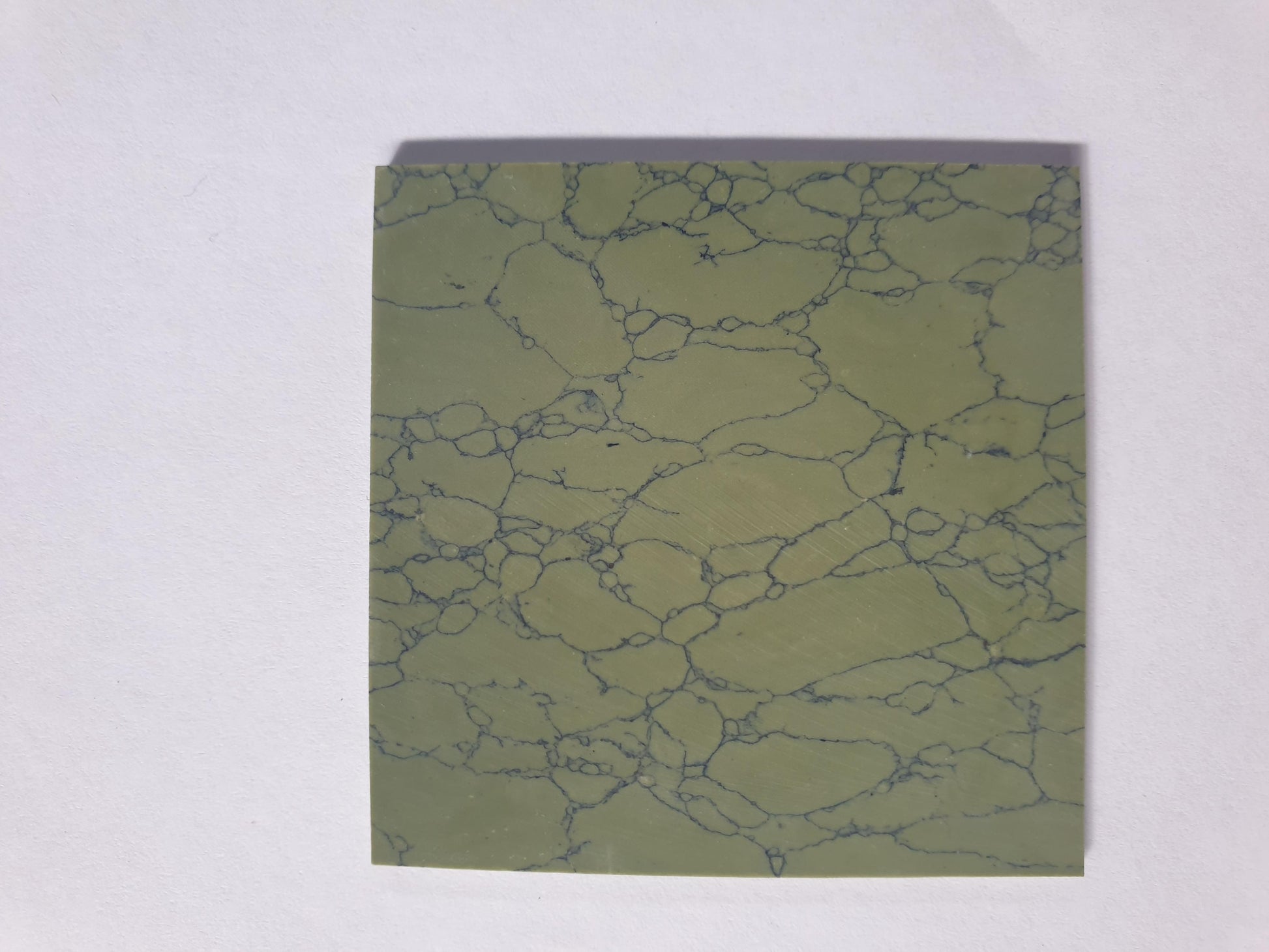<p>Olive stone artificial stone blanks 50 x 50 x 1.5mm suitable for inlay. Can be cut with standard cutting tools - jewellery saw similar in characteristics to mother of pearl (hardness approx. 3. Can be sanded and polished same way as shell material. All pcs are A grade good on both sides.</p>
