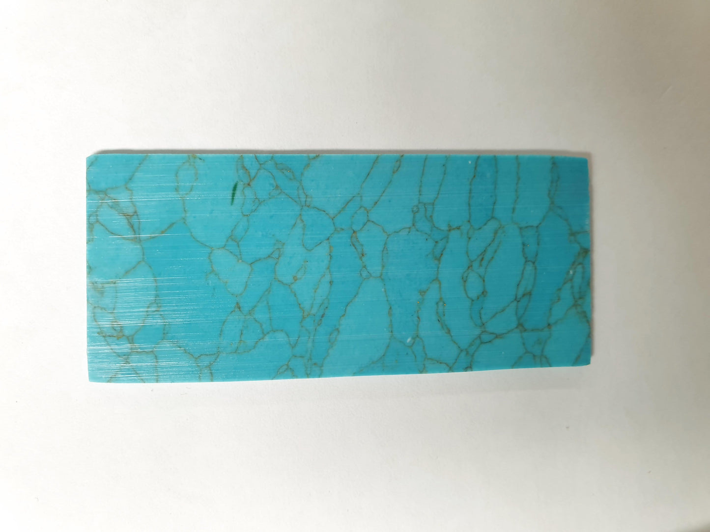 <p>Turquoise Aqua CH1H5 reconstituted stone blanks 30 x 70 x 1.5mm suitable for inlay. Can be cut with standard cutting tools - jewellery saw similar in characteristics to mother of pearl (hardness approx. 3. Can be sanded and polished same way as shell material. All pcs are A grade good on both sides.</p>