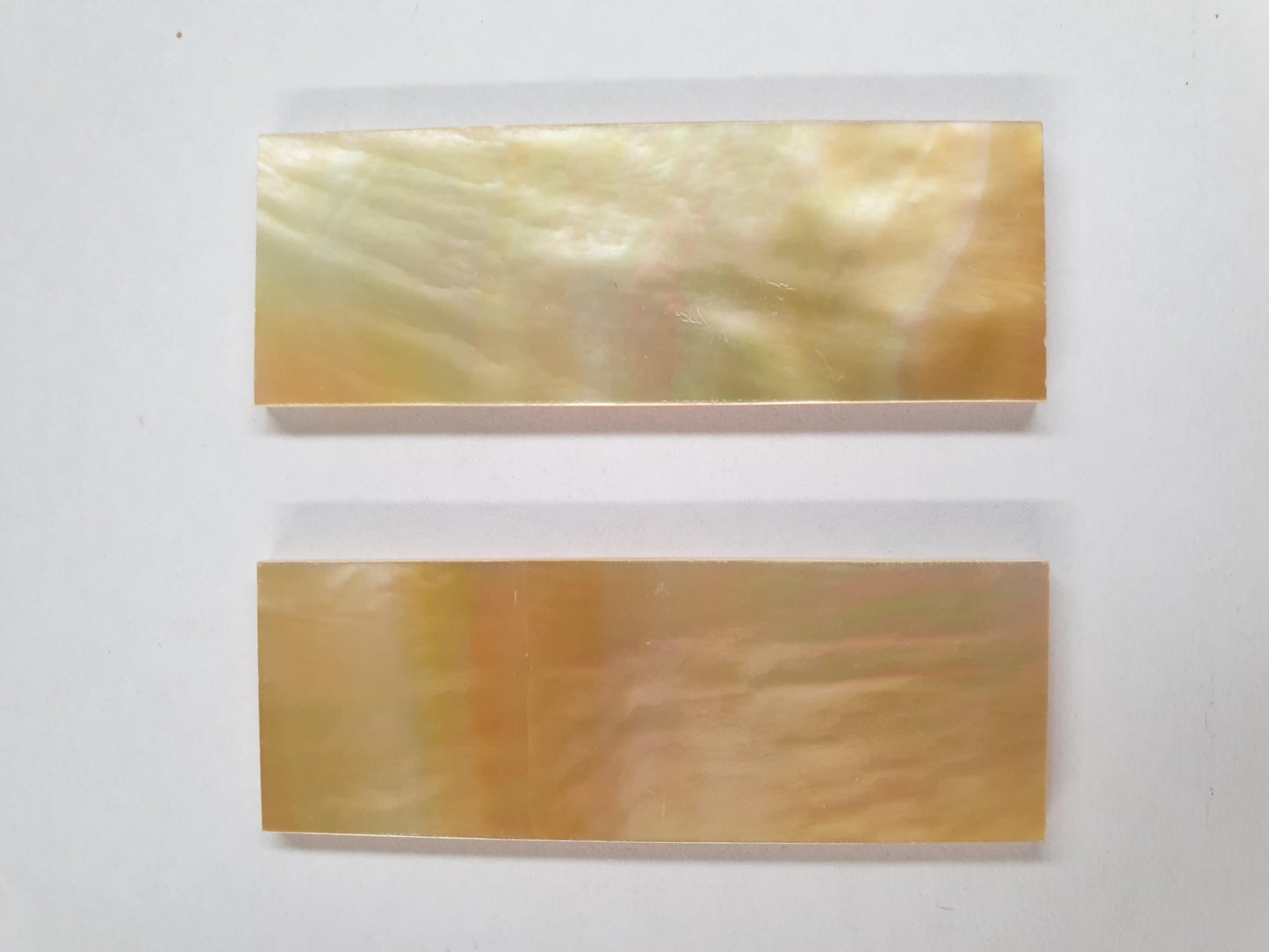 Gold MOP flat inlay blanks size 22mm (0.866") width x 63.5mm (2.5") length x 2mm (0.08") thickness A grade. Polished 1 side.