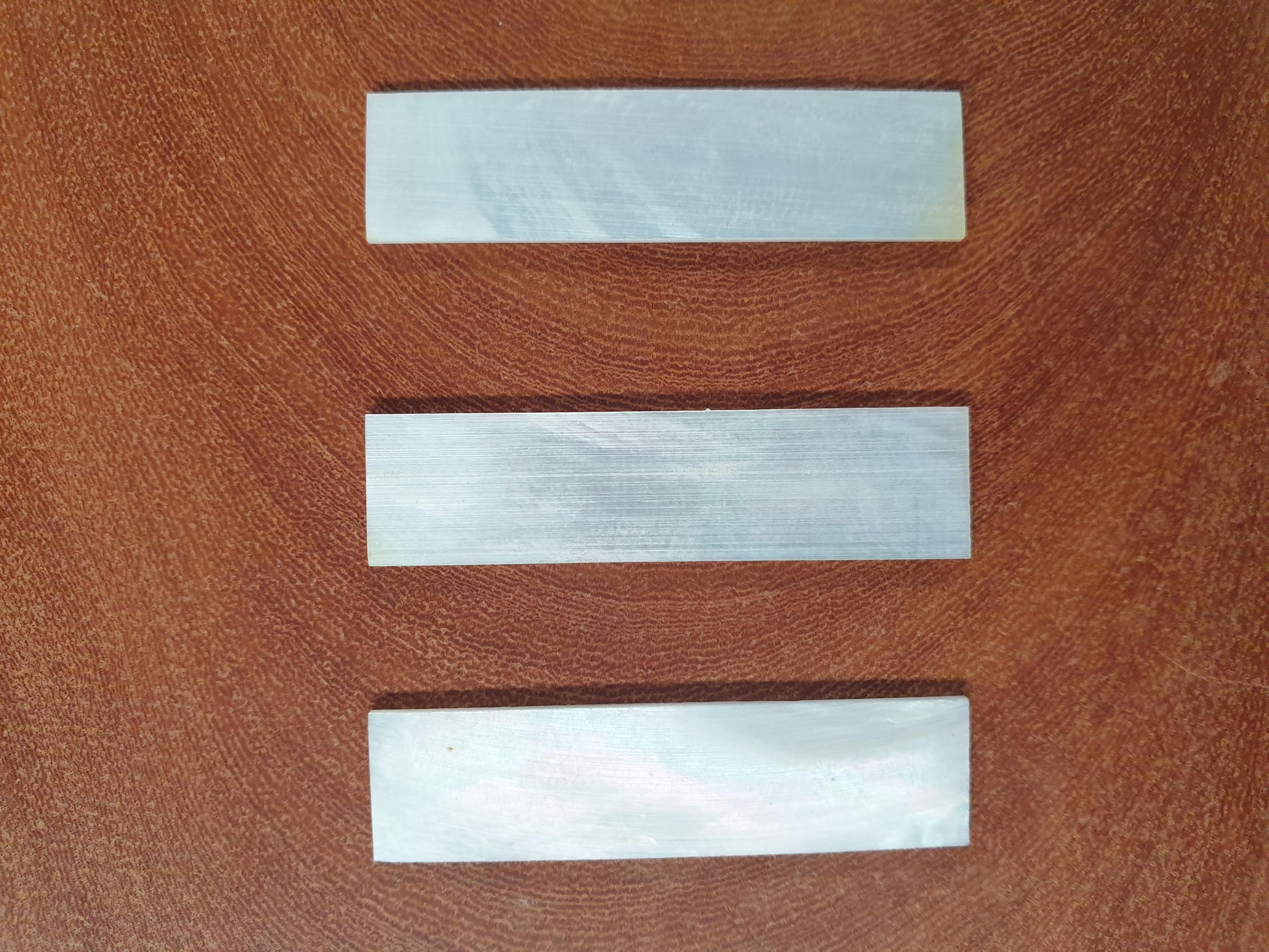 <p>White Mother of Pearl flat blanks size 10mm (0.394") width x 40mm (1.57") length x 1mm (0.04") thickness A grade good on both sides.</p>