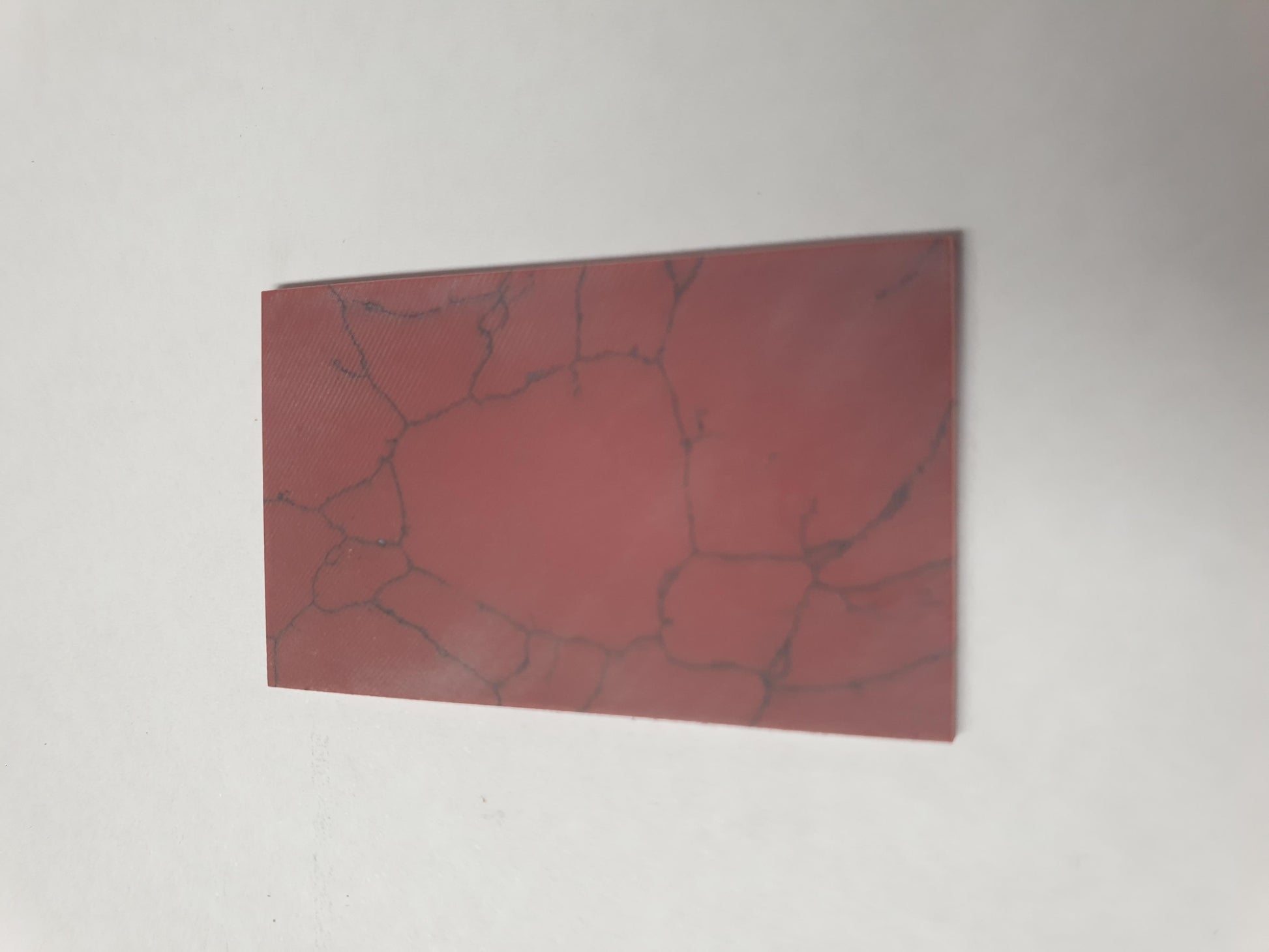 <p>Bloody Jasper artificial stone blanks 30 x 50 x 2.2mm suitable for inlay. Can be cut with standard cutting tools - jewellery saw similar in characteristics to mother of pearl (hardness approx. 3. Can be sanded and polished same way as shell material. All pcs are A grade good on both sides.</p>