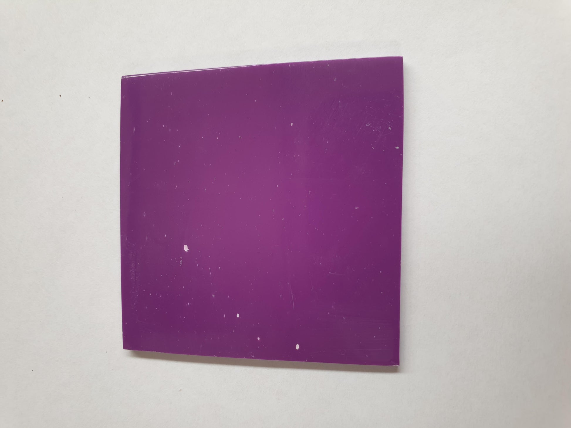 <p>Purple stone O123 artificial stone blanks 50 x 50 x 2mm polished 1 side, suitable for inlay. Can be cut with standard cutting tools - jewellery saw similar in characteristics to mother of pearl (hardness approx. 3. Can be sanded and polished same way as shell material. All pieces are A grade good on both sides.</p>