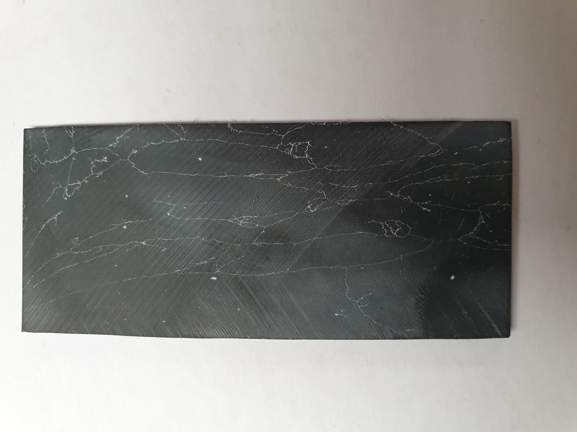 <p>Marble black blanks F050 reconstituted stone blanks 30 x 70 x 2mm suitable for inlay. Can be cut with standard cutting tools - jewellery saw similar in characteristics to mother of pearl (hardness approx. 3. Can be sanded and polished same way as shell material. All pieces are A grade good on both sides.</p>