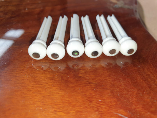 1 set (6pcs) Guitar bridge pins white bone with Black MOP dot size 1 Tapered shaft string slot running the full length of shaft. Diameter at top of shaft 5.3mm (0.21") length of shaft 22.9mm (0.9") . Will fit the following models - Martin guitars prior to 1994 (except HD-28), Collings guitars, prior to 2002, Blanchard, Garrison, Goodall, Ryan, Santa Cruz, Taylor, Larrivee D-03R and others.