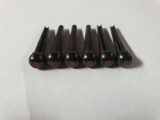 1 set (6pcs) Guitar bridge pins  size 2A Ebony with  bloody jasper dot. Tapered shaft string slot running the full length of shaft. Diameter at top of shaft 5.6mm (0.22") length of shaft 25.5mm (1") . Will fit the following models - Martin guitars since 1994,as well as D-28 older Gibson guitars,and others.