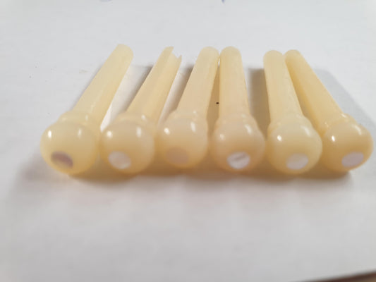 1 set (6pcs) Guitar bridge pins size 1 vintage bone with white Mother of Pearl dot  Tapered shaft string slot running the full length of shaft. Diameter at top of shaft 5.3mm (0.21") length of shaft 22.9mm (0.9") . Will fit the following models - Martin guitars prior to 1994 (except HD-28), Collings guitars, prior to 2002, Blanchard, Garrison, Goodall, Ryan, Santa Cruz, Taylor, Larrivee D-03R and others.