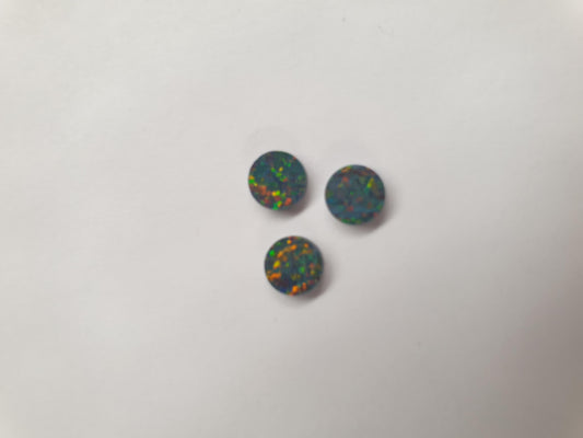 <p>Opal dots OP32 6 x 1.3mm flat pcs made to specific diameter and thickness made from manufactured opal suitable for inlay, fretboard markers, jewellery, Opal dots can be worked same way as mother of pearl and are of similar hardness.</p>