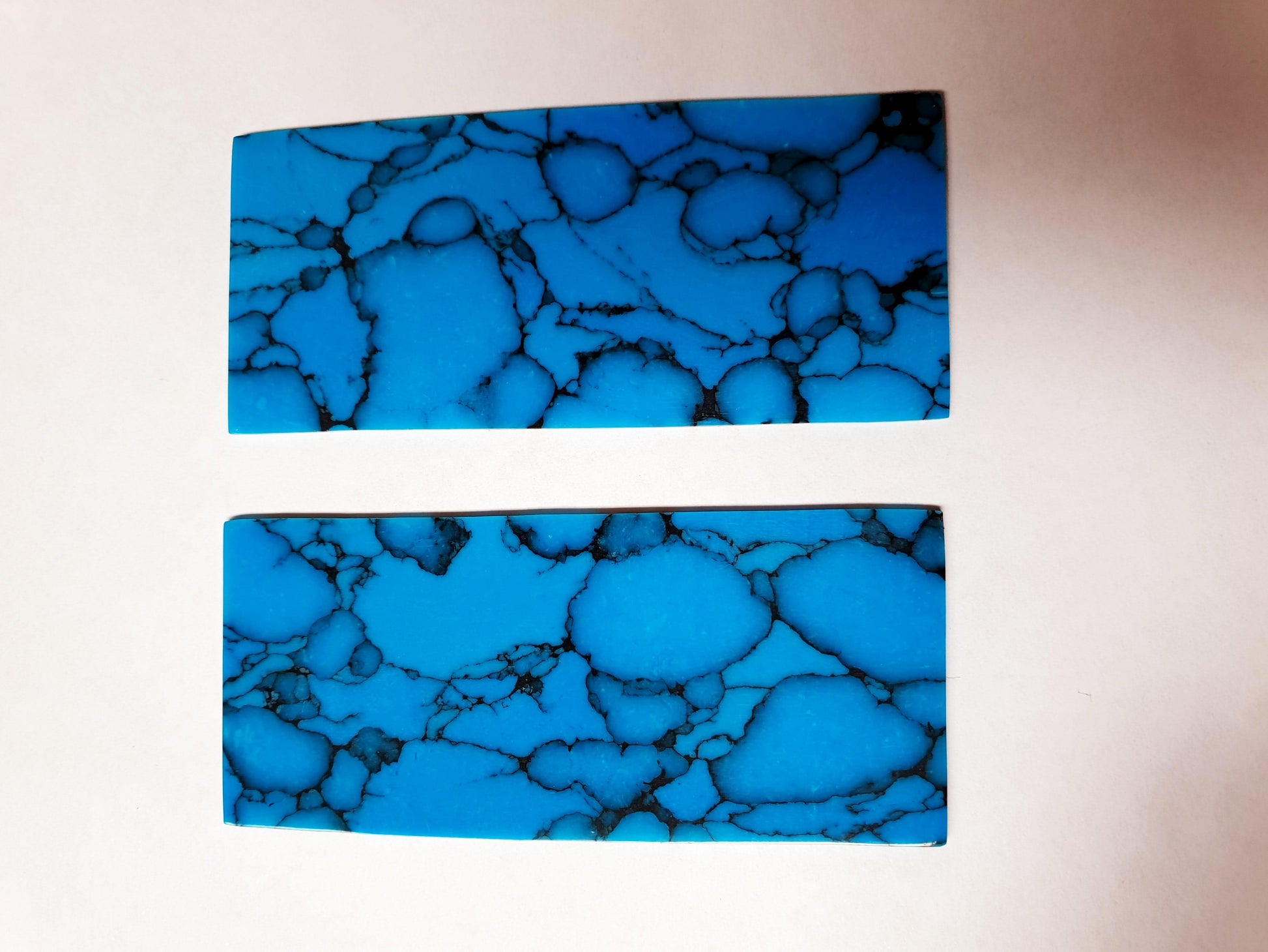 Turquoise B013 artificial stone blanks 30 x 70 x 2mm suitable for inlay. Can be cut with standard cutting tools - jewellery saw similar in characteristics to mother of pearl (hardness approx. 3. Can be sanded and polished same way as shell material. All pcs are A grade good on both sides.