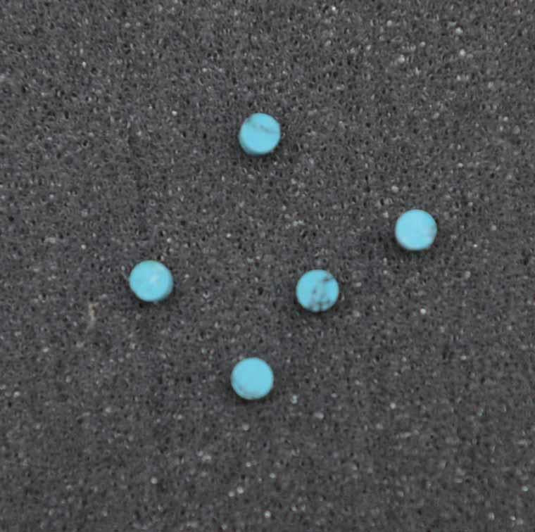 Turquoise STURB1 dots 2mm diameter x 1.3mm thickness - round flat pcs cut to precise diameter and thickness. Ideal for use in inlay applications - for fretboard markers, and general inlay or jewellery decorations. All dots are A grade good on both sides.