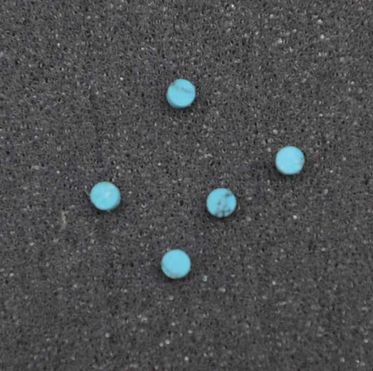 Turquoise STURB1 dots 2mm diameter x 1.3mm thickness - round flat pcs cut to precise diameter and thickness. Ideal for use in inlay applications - for fretboard markers, and general inlay or jewellery decorations. All dots are A grade good on both sides.