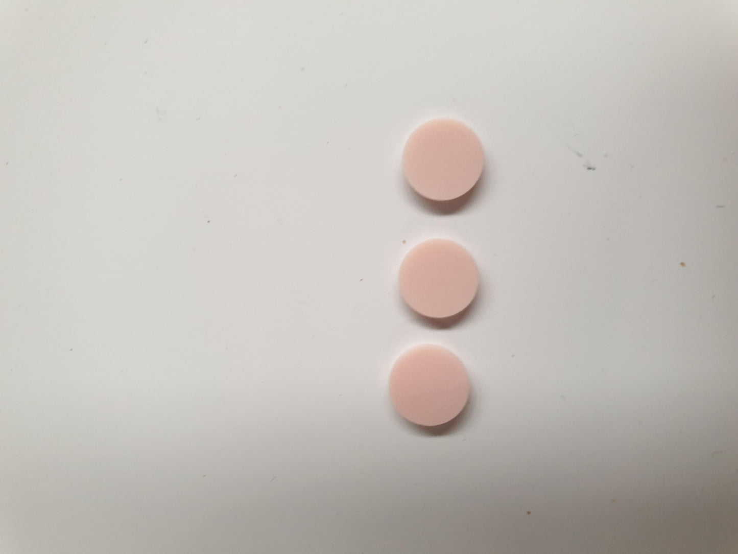  Pink stone RPINK1 artificial stone dots 9 x 1.3mm thickness - round flat pcs cut to precise diameter and thickness. Ideal for use in inlay applications - for fretboard markers, and general inlay or jewellery decorations. All dots are A grade good on both sides.