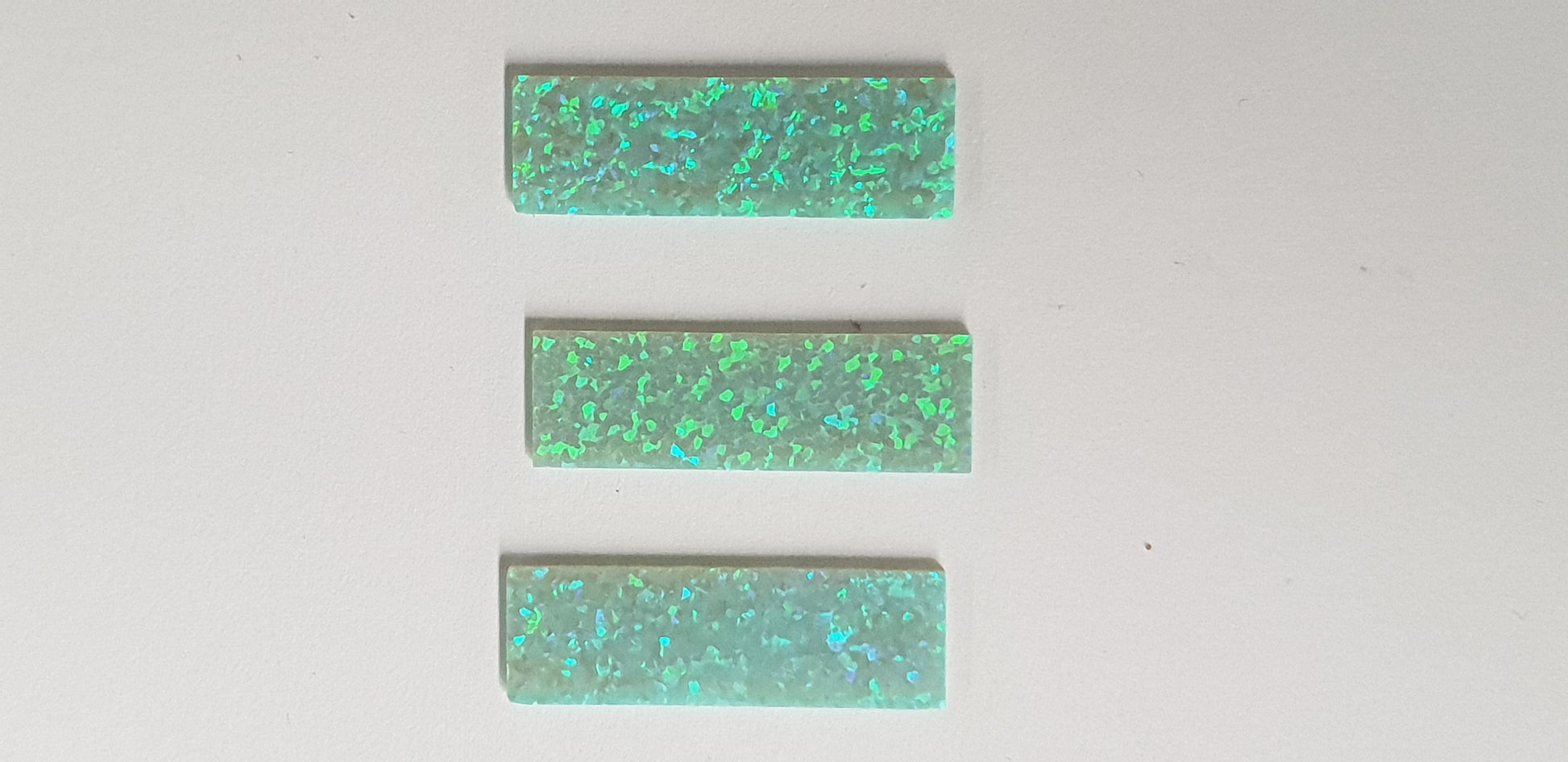Opal blanks OP11 9 x 29 x 1mm flat cut pcs made from manufactured opal blocks suitable for inlay jewellery, bow slides. Opal blanks can be cut same way as mother of pearl blanks and are of similar hardness.