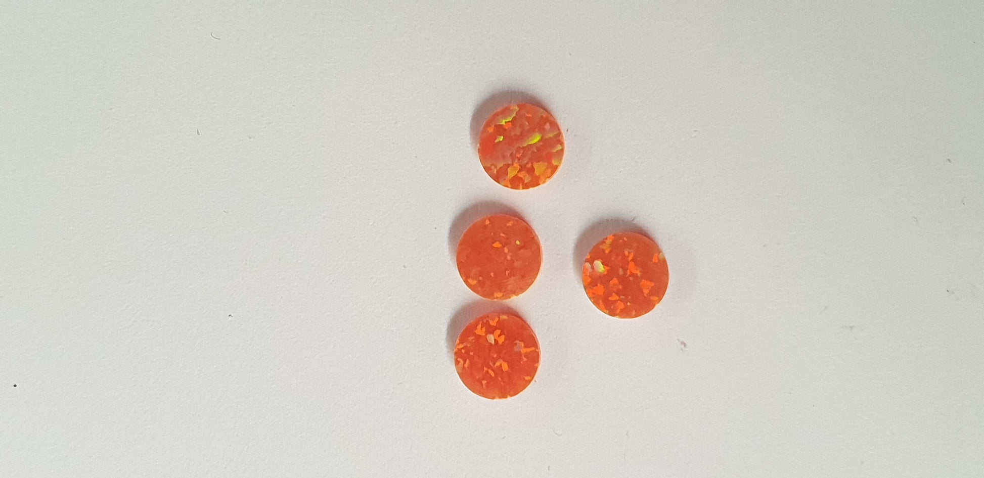 Opal dots OP30 7 x 1.3mm flat pcs made to specific diameter and thickness made from manufactured opal suitable for inlay, fretboard markers, jewellery, Opal dots can be worked same way as mother of pearl and are of similar hardness..