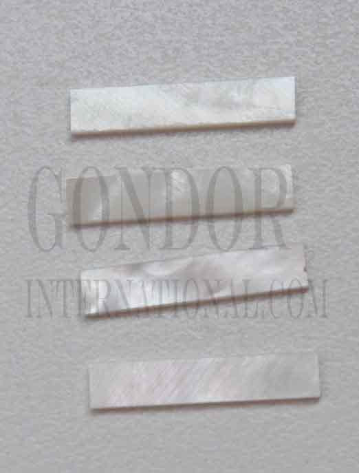 White Mother of Pearl solid shell straight strips 6.4mm width x 32mm length x 1.5mm thickness. A grade quality good on both sides, flat and uniform in thickness and width. Ideal for use in purfling on musical instruments - Ukuleles, guitars, mandolins etc. as well as in furniture, jewellery ans other decorative applications.