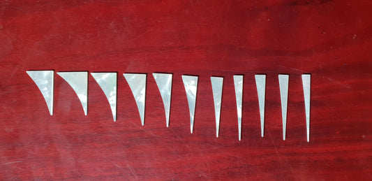 <p>A set of 11pcs White MOP Shark fin inlays. Thickness 1.5mm. Flat and ready to be installed.</p>