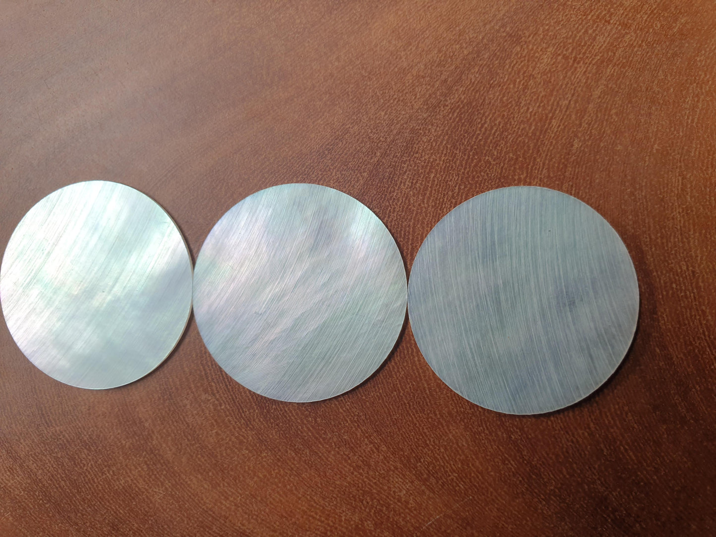White Mother of Pearl discs 36mm (1.417") diameter x 0.8mm (0.03") thickness. Clear face no figure. Round flat clear shell pcs cut to precise diameter and thickness. Ideal for watch dials and jewellery decorations. All discs are A grade good on both sides.