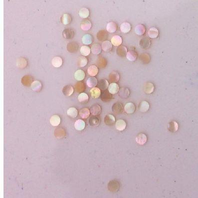Awabi shell dots 2mm diameter 1.5mm thickness are round flat shell pcs cut to precise diameter and thickness. Ideal for use in inlay applications - for fretboard markers and general inlay or jewellery decorations.