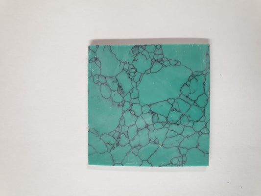 Turquoise Green M114 artificial stone blanks 50 x 50 x 1.5mm polished 1 side. Suitable for inlay. Can be cut with standard cutting tools - jewellery saw similar in characteristics to mother of pearl (hardness approx. 3. Can be sanded and polished same way as shell material. All pcs are A grade good on both sides.