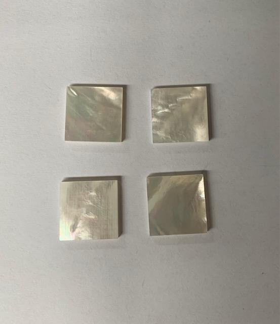 <p>White Mother of Pearl flat inlay blanks size 12mm x 12mm x 1mm (0.04") thickness A grade polished 1 side and clean on both sides.</p>