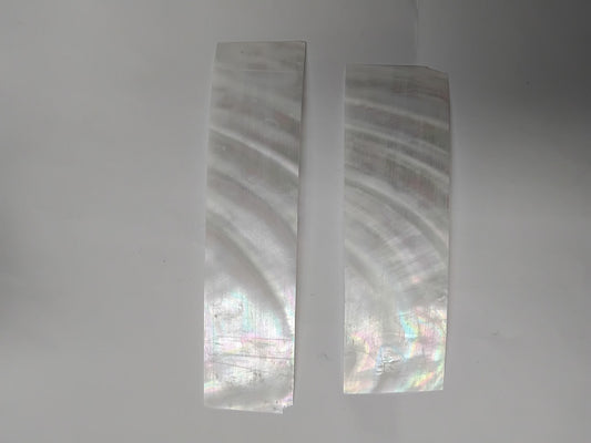 Fresh water pearl feathers white colour&nbsp;feathers 30mm width x 80mm to 120mm length x 0.15mm (0.006") thickness - thinly sliced solid shell pcs. Cut along the curved part of shell they can yield larger pcs then standard solid shell blanks. Ideal for shallow inlay, overlay, fishing lure manufacture and other decorative purposes. Select quality A grade.